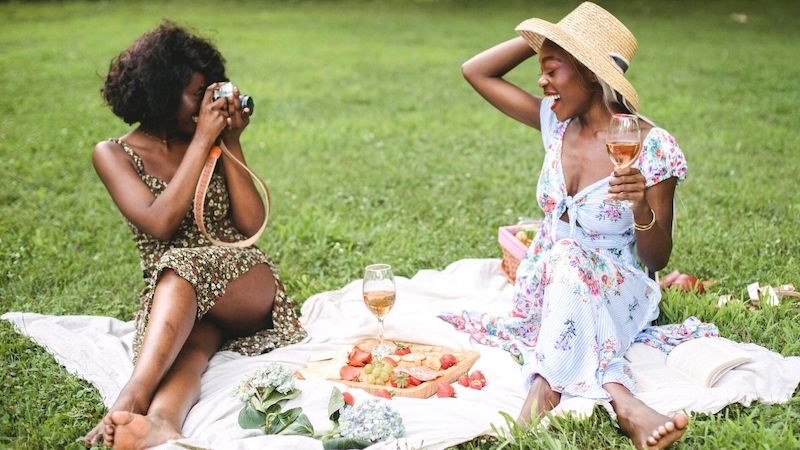 two women enjoying a beautiful picnic in NYC
