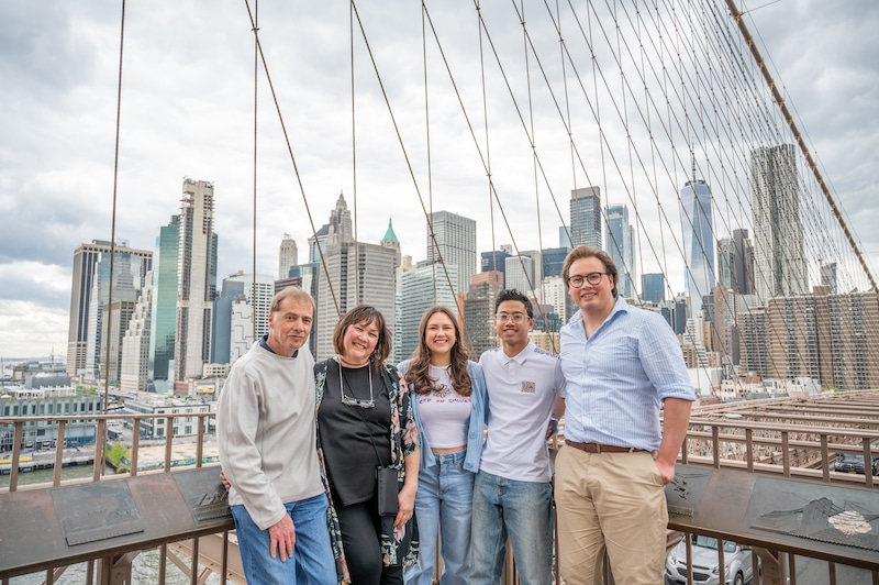family posing for a Brooklyn Bridge photoshoot