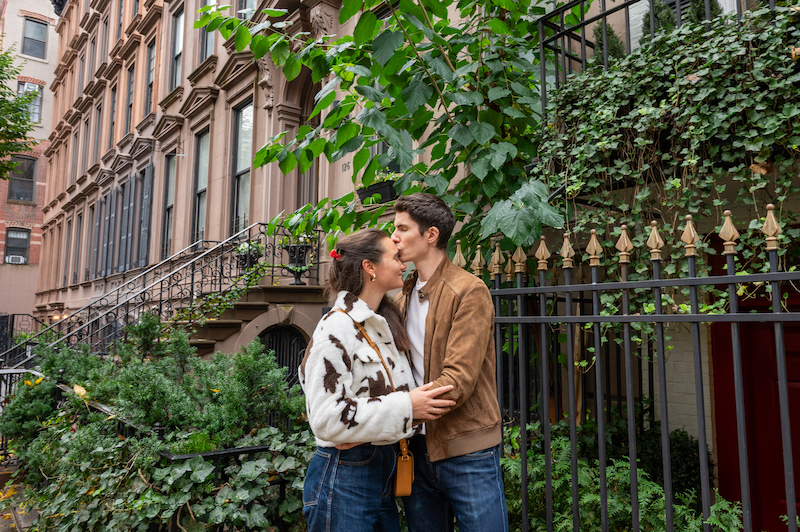 couple kissing in the Upper East Side during an NYC engagement shoot